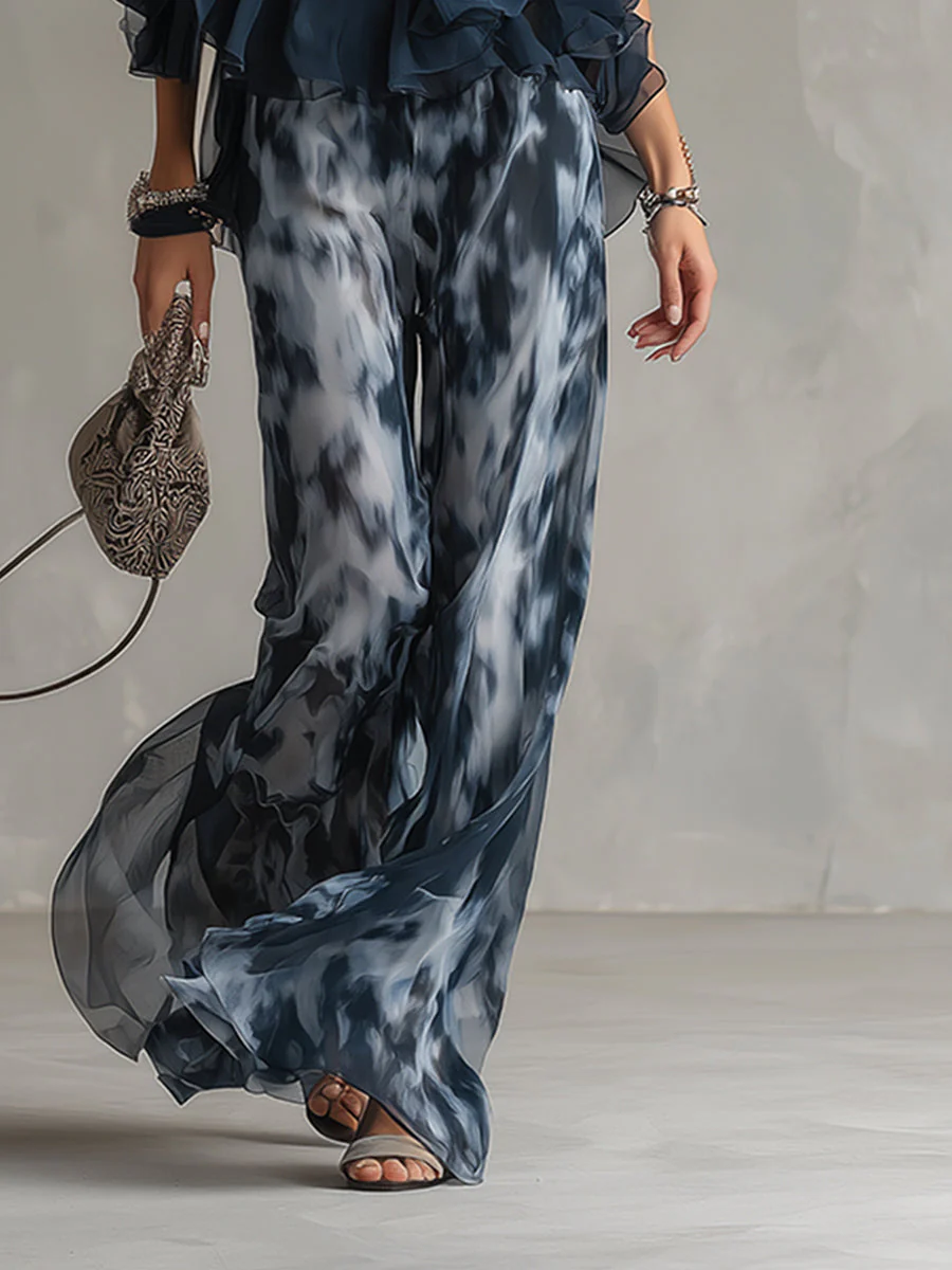 ELEGANTE IN CHIFFON CON TOP A COLLO ALTO E PANTALONI LARGHI STAMPATI