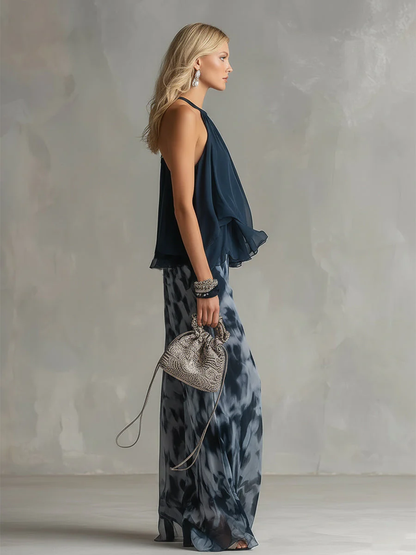 ELEGANTE IN CHIFFON CON TOP A COLLO ALTO E PANTALONI LARGHI STAMPATI