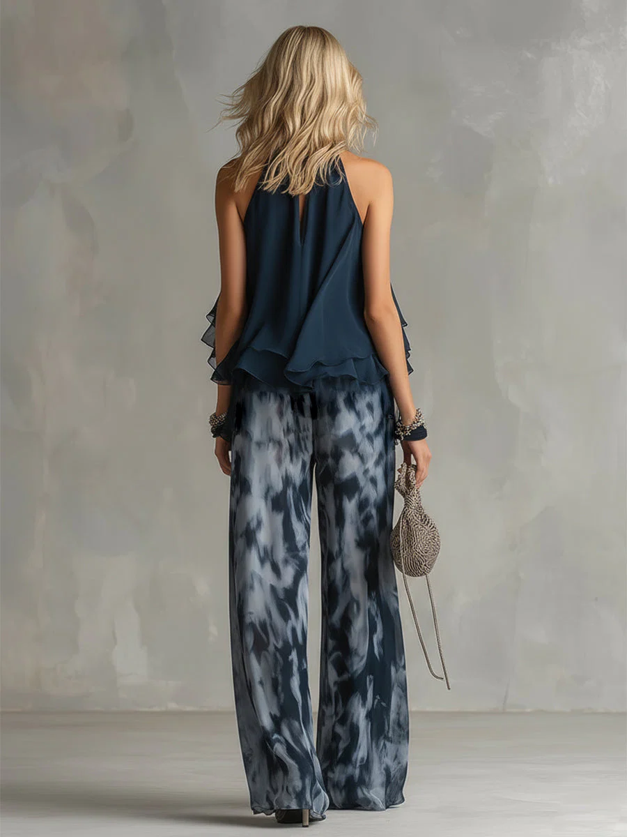 ELEGANTE IN CHIFFON CON TOP A COLLO ALTO E PANTALONI LARGHI STAMPATI