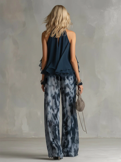 ELEGANTE IN CHIFFON CON TOP A COLLO ALTO E PANTALONI LARGHI STAMPATI