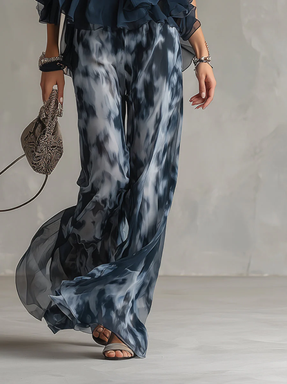 ELEGANTE IN CHIFFON CON TOP A COLLO ALTO E PANTALONI LARGHI STAMPATI