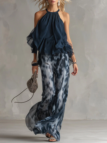 ELEGANTE IN CHIFFON CON TOP A COLLO ALTO E PANTALONI LARGHI STAMPATI